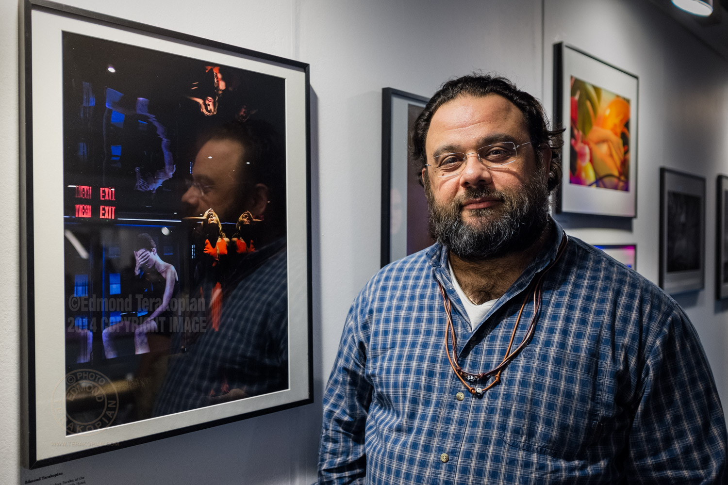 2014 AOP Photographers Awards. Photographer Edmond Terakopian by his portrait of Andrea Feczko which was a finalist in the Open Award. Islington Business Design Centre, London. December 11, 2014. Photo: Nathan Wake
